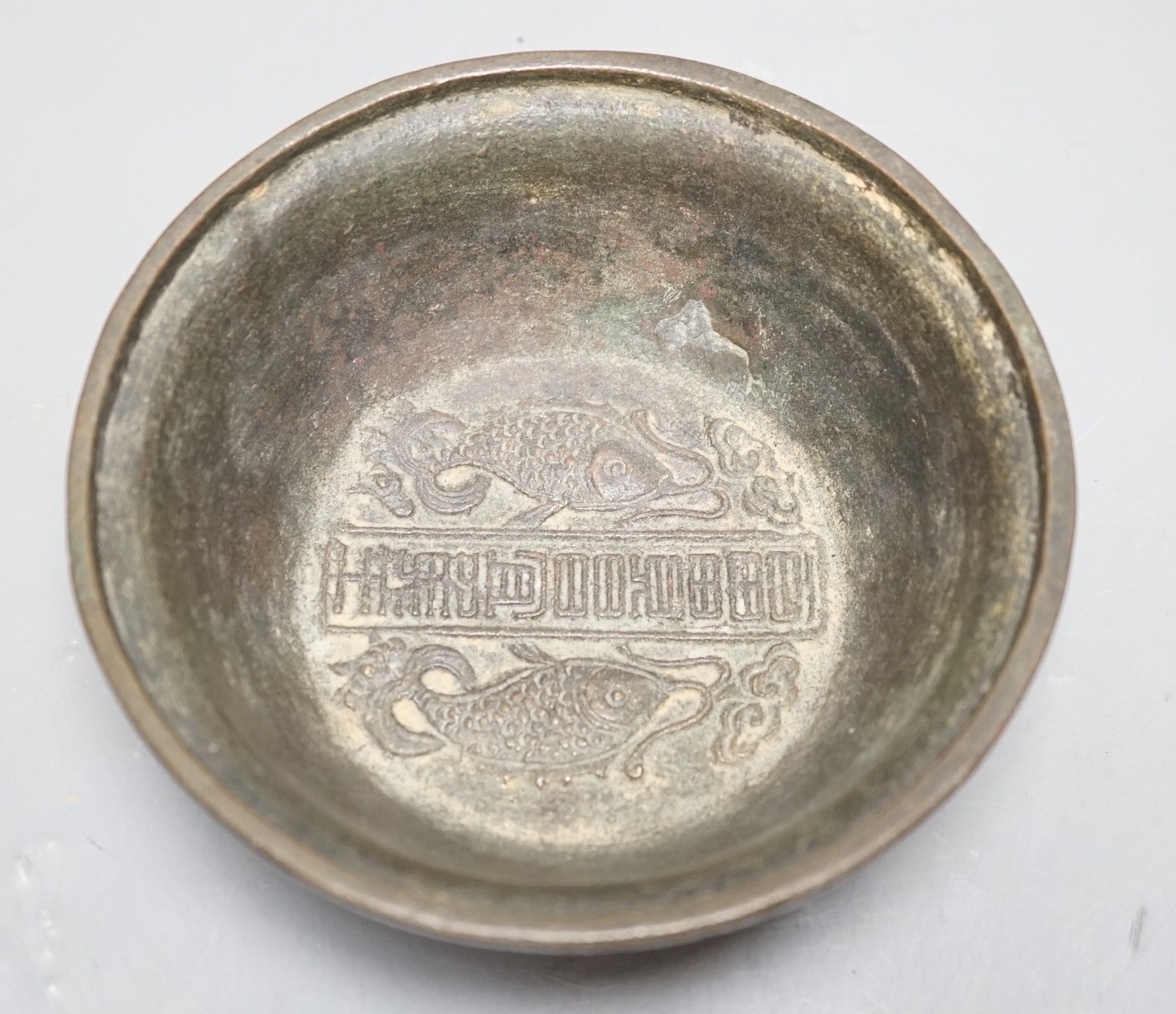 A Chinese bronze bowl, with inscriptions, possibly 18th century, 13.5cm diameter, two pieces of Japanese Kutani, a small Imari vase and three Chinese tea pots